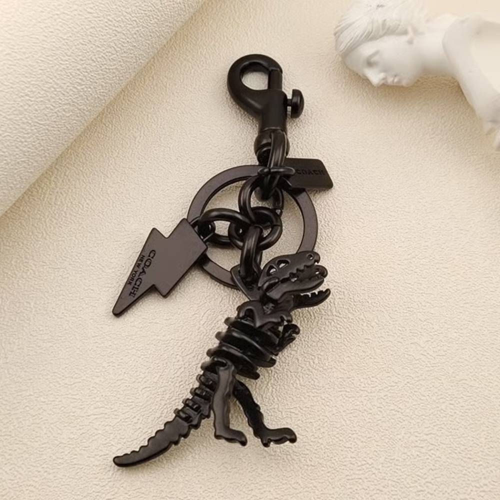 Coach Black T-Rex Skeleton Keychain with Lightning Charm